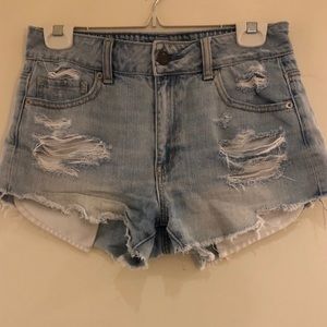 Distressed light denim shorts